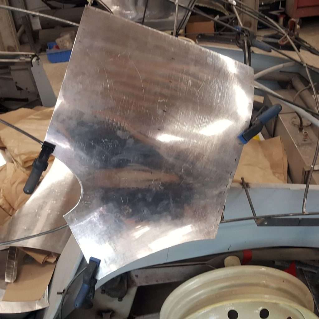 Creating panels for the 1953 Jowett Jupiter often starts with a card prototype to achieve the desired form, then transfer it to aluminium for the English Wheel. This enables us to transform flat metal sheets into stunning compound curves.