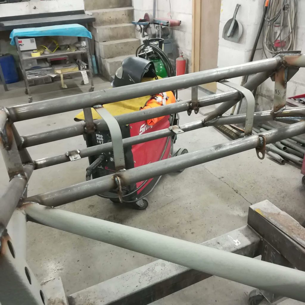 The Jowett Jupiter’s new fuel tank straps during fabrication and installation.