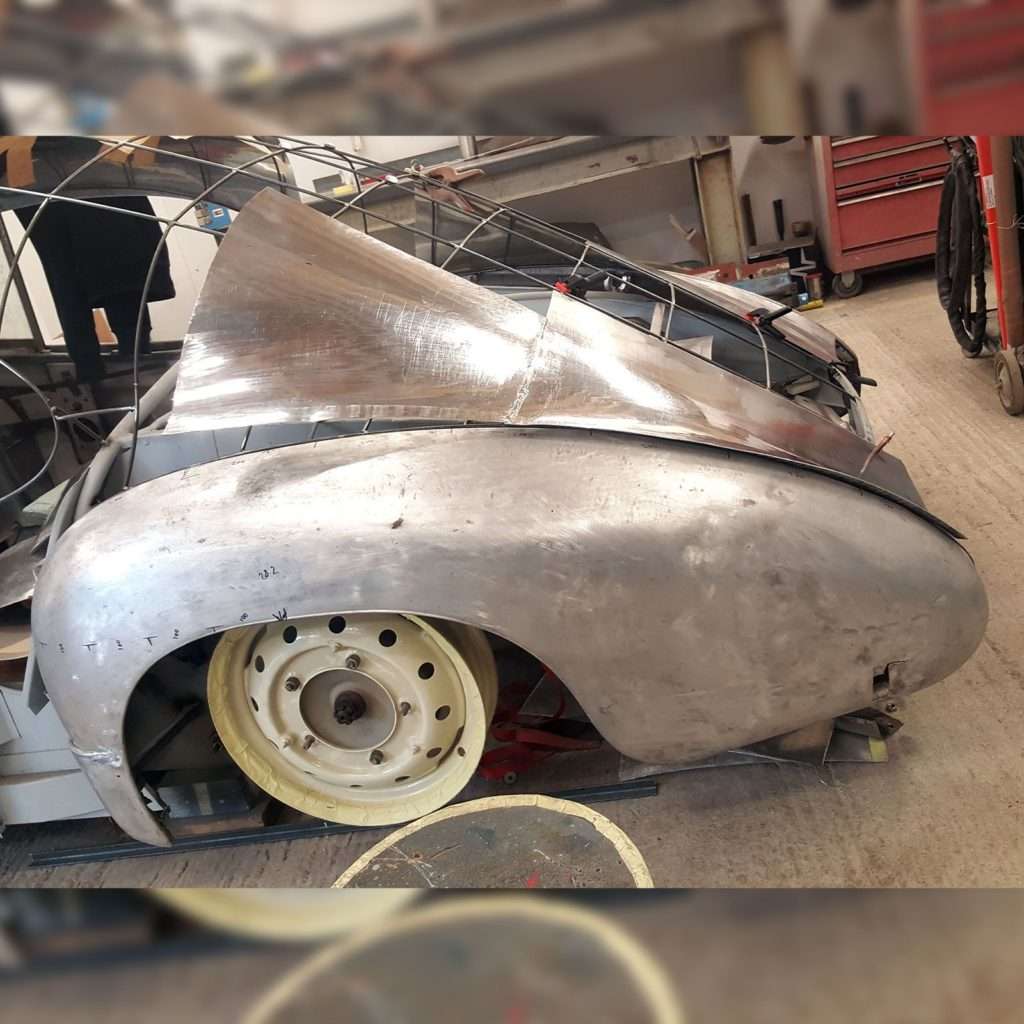 On the 1953 Jowett Jupiter we start by hammering the metal into a rough shape, before our skilled team uses a planishing hammer and English wheel to meticulously remove indentations and shape it flawlessly.