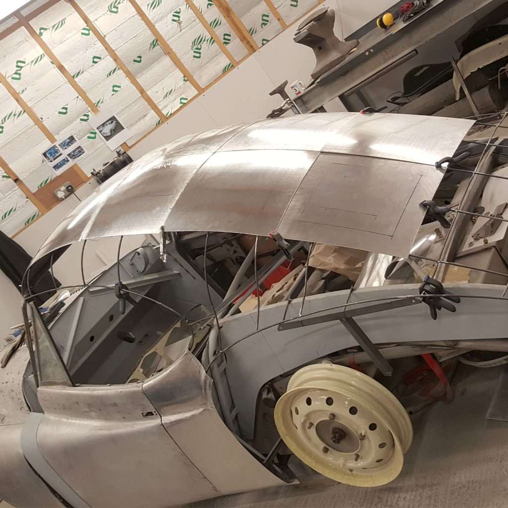 The 1953 Jowett Jupiter roof merging into the back is taking shape, gracefully bringing together the stylish fastback silhouette.