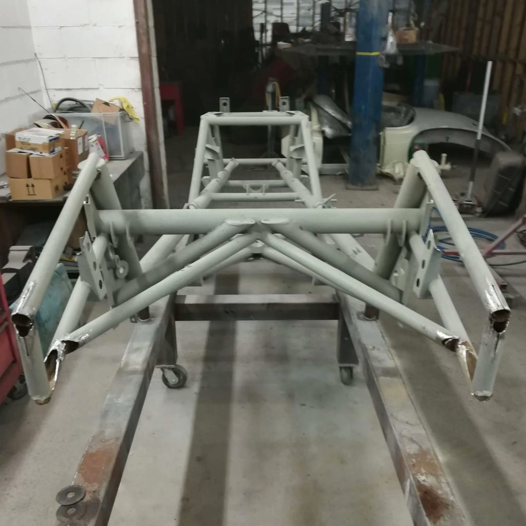 The first job with the Jowett Jupiter chassis is to attach it to a jig. This lets us keep everything straight and square when working to remove the damage.