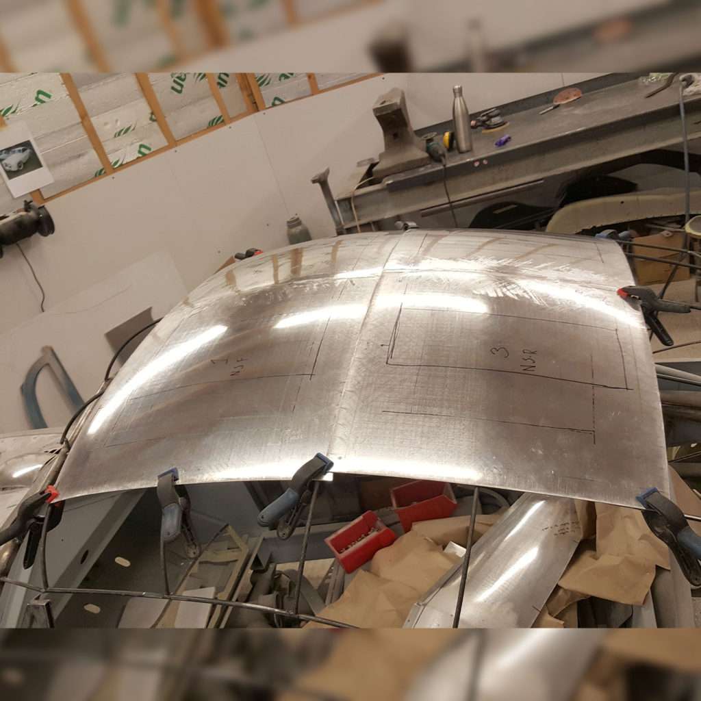 We're carefully placing the centre of the roof and expertly joining it onto the sides of the 1953 Jowett Jupiter.