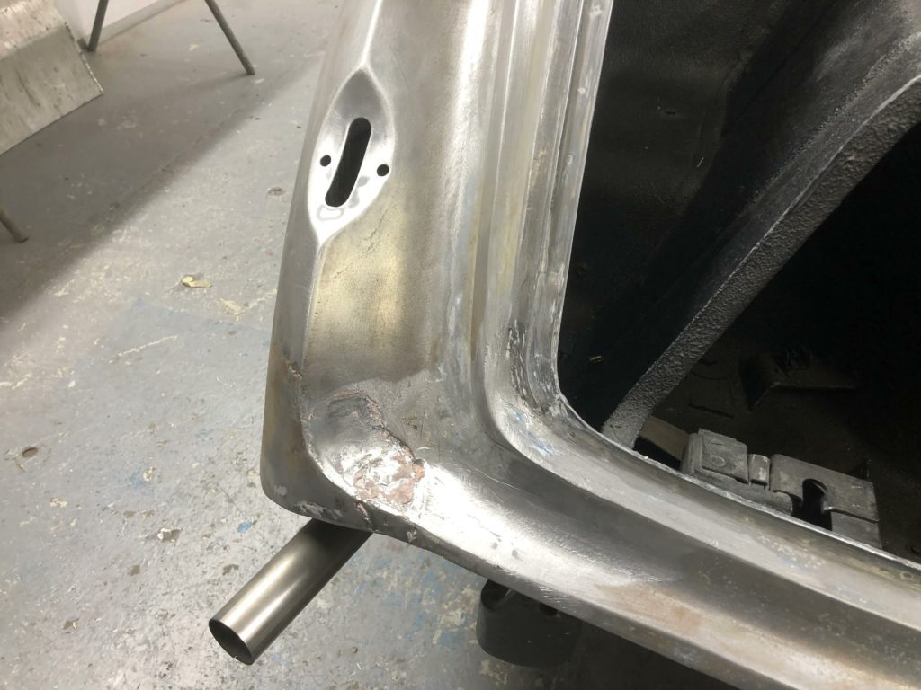 The lower rear end of the Bentley R Type had these unacceptable pieces of precious repair work. While it looked ‘fine’ before and a bumper covered some of the area, this is the kind of work we love to repair to ensure a beautiful finish.