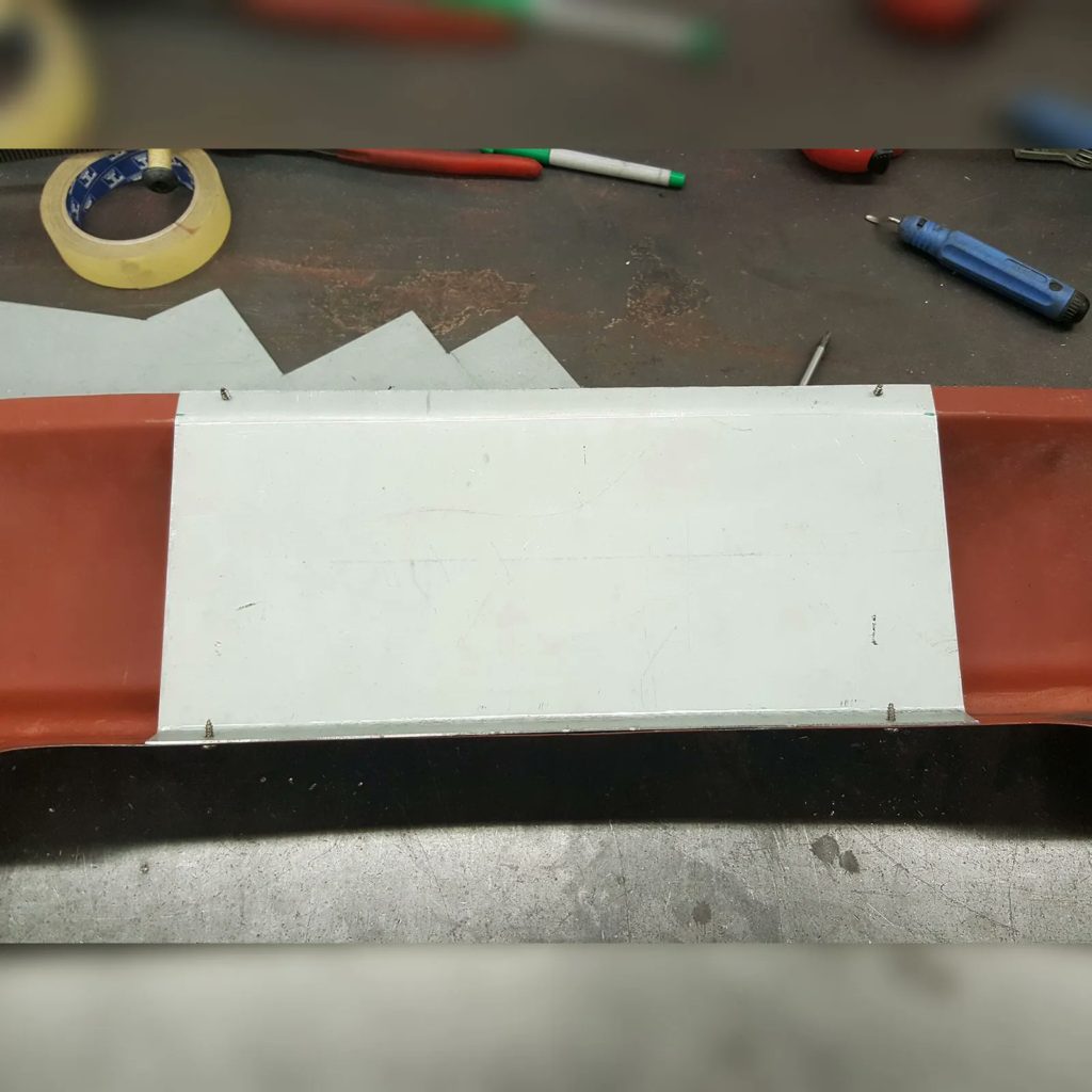 Starting work on a new fabrication on the Plastics4Performance 1969 Mini Cooper 998 MkII. Folding the edge on the front panel to accommodate an oil cooler isn’t good enough for us, so we’re fabricating an oil cooler support bracket.