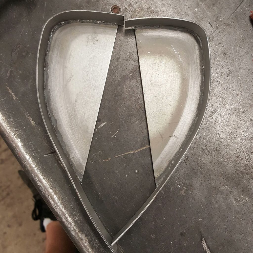 Starting work on a new fabrication on the Plastics4Performance 1969 Mini Cooper 998 MkII. Folding the edge on the front panel to accommodate an oil cooler isn’t good enough for us, so we’re fabricating an oil cooler support bracket.