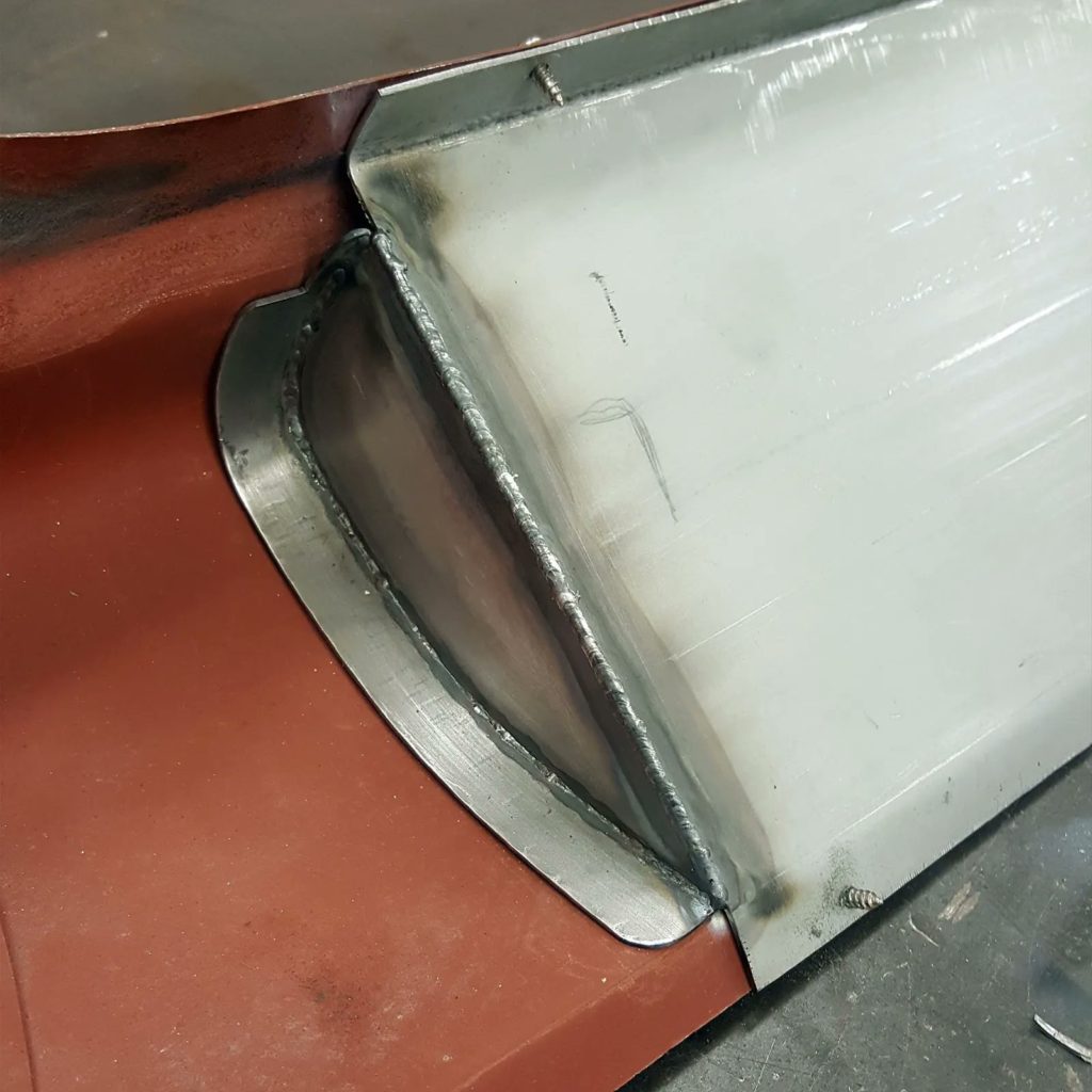 Starting work on a new fabrication on the Plastics4Performance 1969 Mini Cooper 998 MkII. Folding the edge on the front panel to accommodate an oil cooler isn’t good enough for us, so we’re fabricating an oil cooler support bracket.