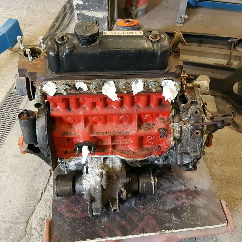 Engine out and ready for dismantling on the Midas MkII! We can't wait to see what's inside and get to work on restoring this classic car.